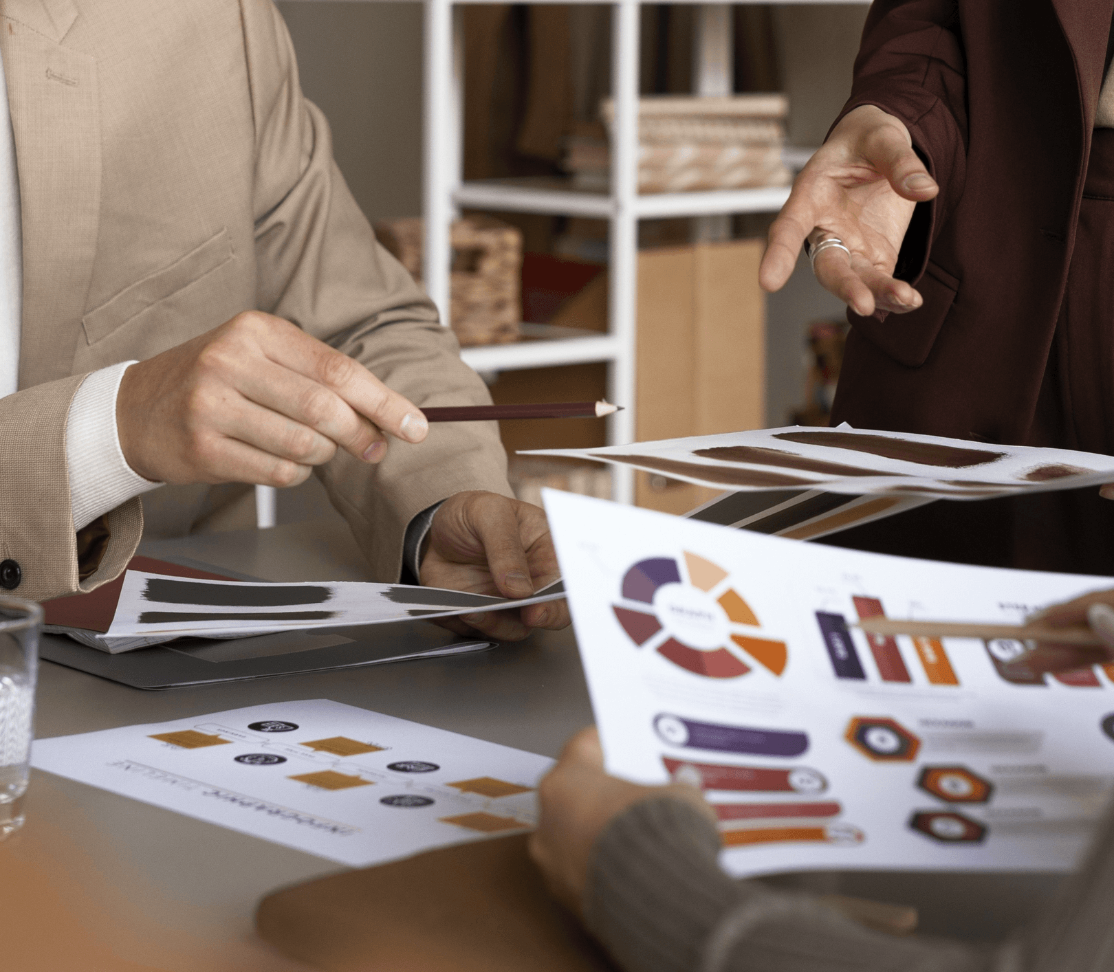 Strategic brand planning documents and mood boards on desk